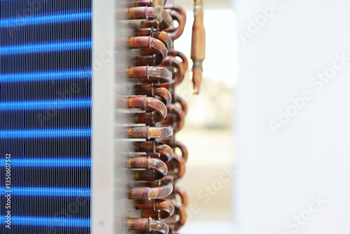 Copper tube heat exchanger with aluminium blue fin coating use in refrigerant circuit for air conditioner or dehumidifier as evaporator and condenser devices.