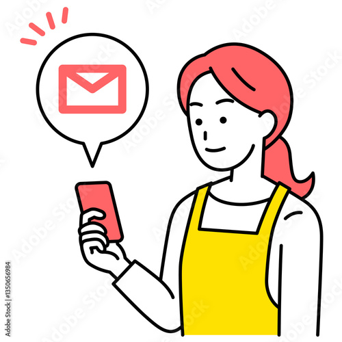 スマートフォンでメールを受信するエプロン姿の女性