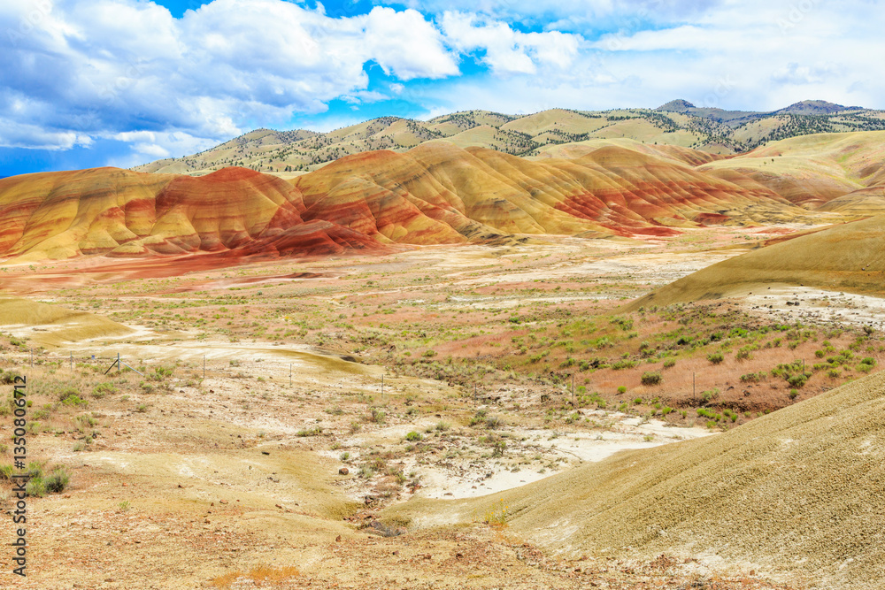 North America, United States, Oregon, Central Oregon, Redmond, Bend, Mitchell. Series of low clay hills striped in colorful bands of minerals, ash and clay deposits.