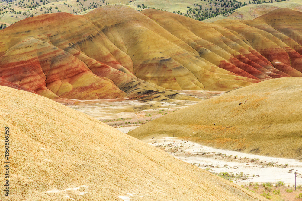 North America, United States, Oregon, Central Oregon, Redmond, Bend, Mitchell. Series of low clay hills striped in colorful bands of minerals, ash and clay deposits.