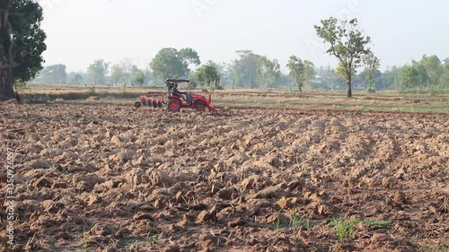 tractor is working in the rice field.