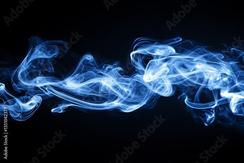 Beautiful blue wisps of smoke drifting across a dark background