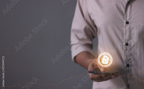 Young man with smartphone mobile hand touching to trade cryptocurrencies online, Investors in cryptocurrencies and bitcoin coins online
