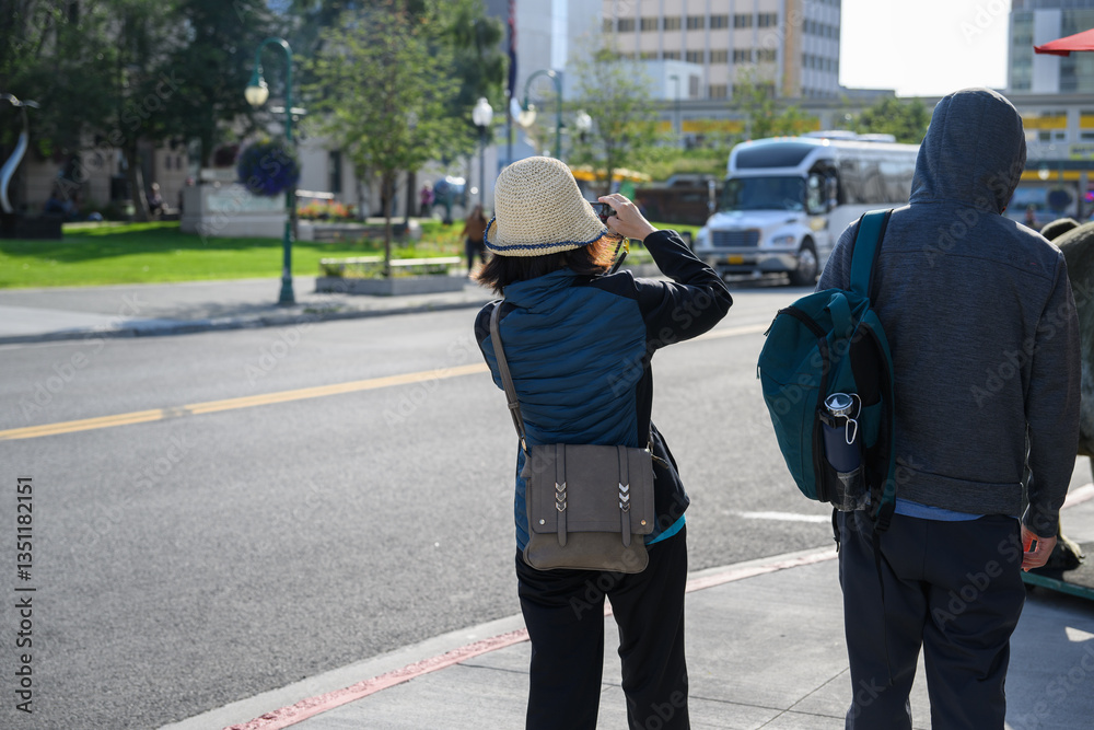 Tourists taking photos of downtown Anchorage. Alaska.