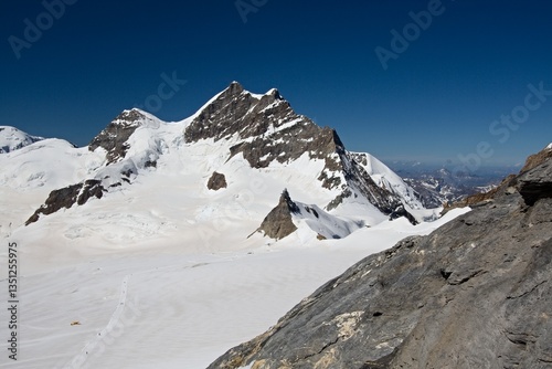 View from Monch mountain to Jungfrau peak and Bernese Alps. Switzerland. Europe.
