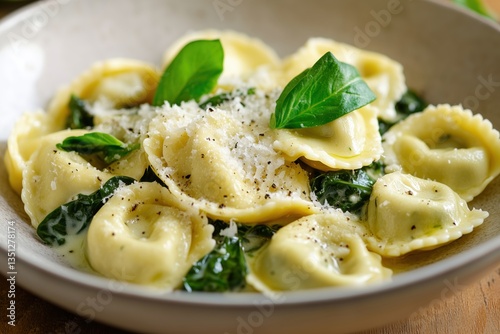Fresh spinach ricotta tortellini in sage butter with shaved Parmesan