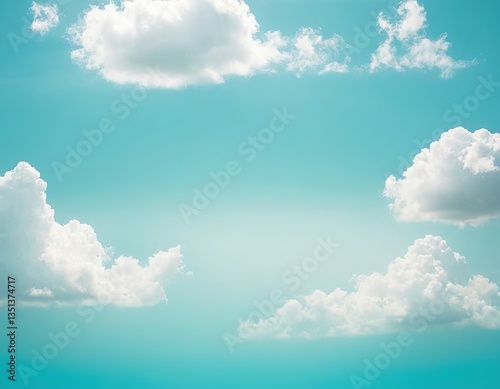 Fluffy white clouds float across a serene turquoise sky, creating a calm and tranquil atmosphere.