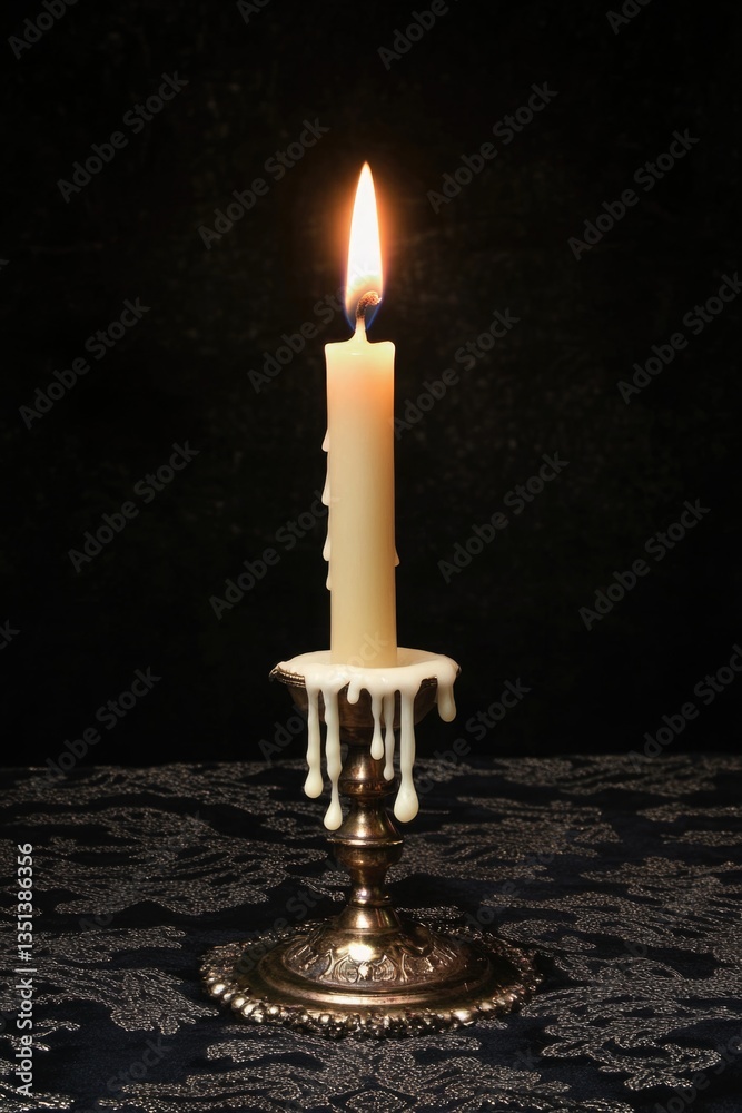 A single lit candle placed on a table, ready for use
