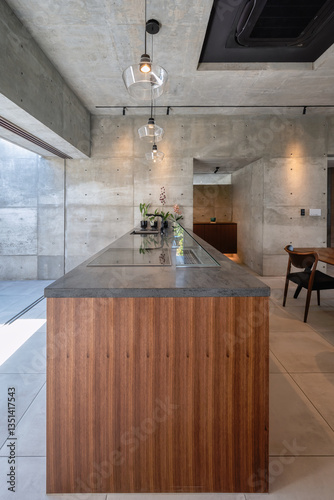 New build modern minimalist house in Okinawa, Japan, constructed of reinforced concrete and glass, with black fixtures and art objects creating a simple but luxurious feel.