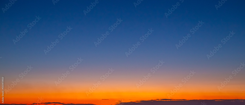 Fototapeta premium Sunset dark blue sky with orange gradient. Sky landscape, panorama