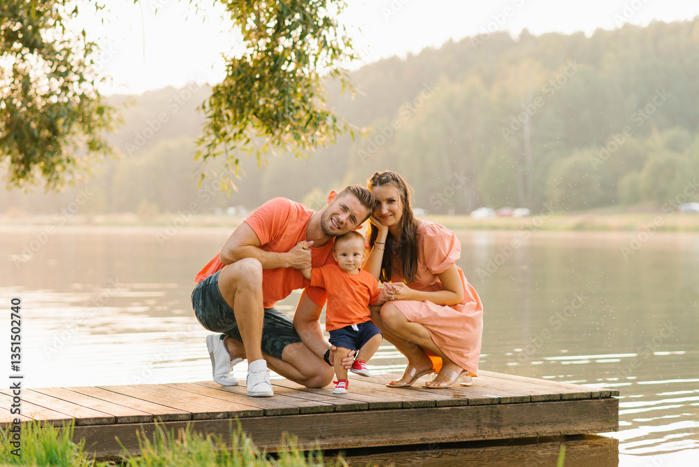 Family Sitting On Wooden Dock