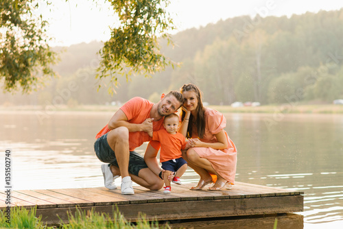 Obraz na płótnie Family Sitting On Wooden Dock w salonie