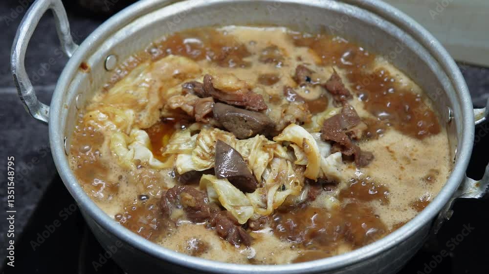 Process of cooking beef meat and bone, boiling meat to make it tender. Process of cooking beef meat and bone, boiling meat to make it tender.