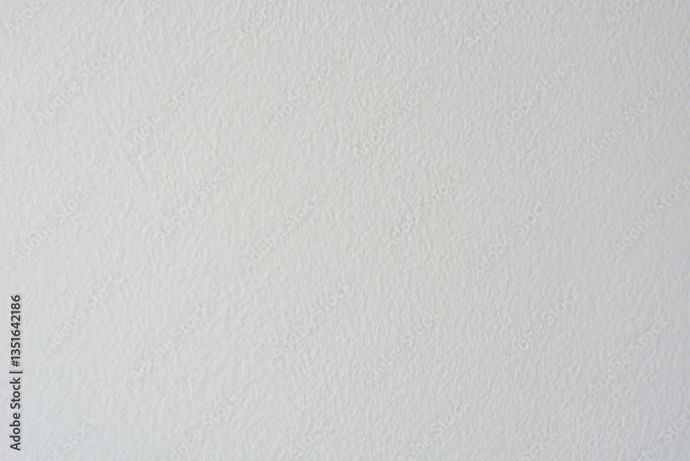 White textured wall with subtle variations in light across a smooth surface White textured wall with subtle variations in light across a smooth surface