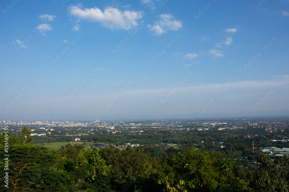 Obraz premium Aerial view landscape cityscape of Mae Hia city and Chiangmai capital from Wat Phra That Doi Kham or Temple of the Golden Mountain in Chiang Mai, Thailand