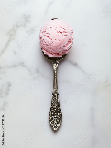 Pink strawberry ice cream scoop on vintage ornate spoon over marble background, ideal for dessert branding, minimalist food styling, or summer menu design