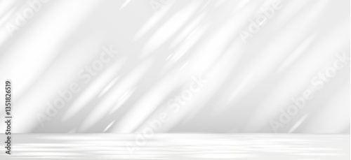 Glare from the sun's rays on the wall. Blurred shadows from leaves and plants in the room. Soft overlay of natural light. Abstract background for product presentation.Natural light layout.