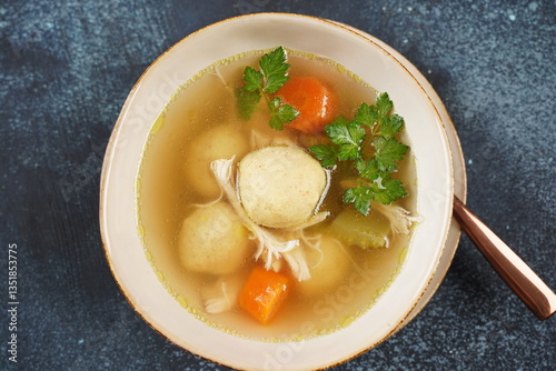 Jewish chicken broth with kneidlach (balls made with matzo meal)Matzo ball soup