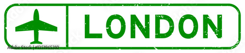 Grunge green london word with plane icon square rubber seal stamp on white background