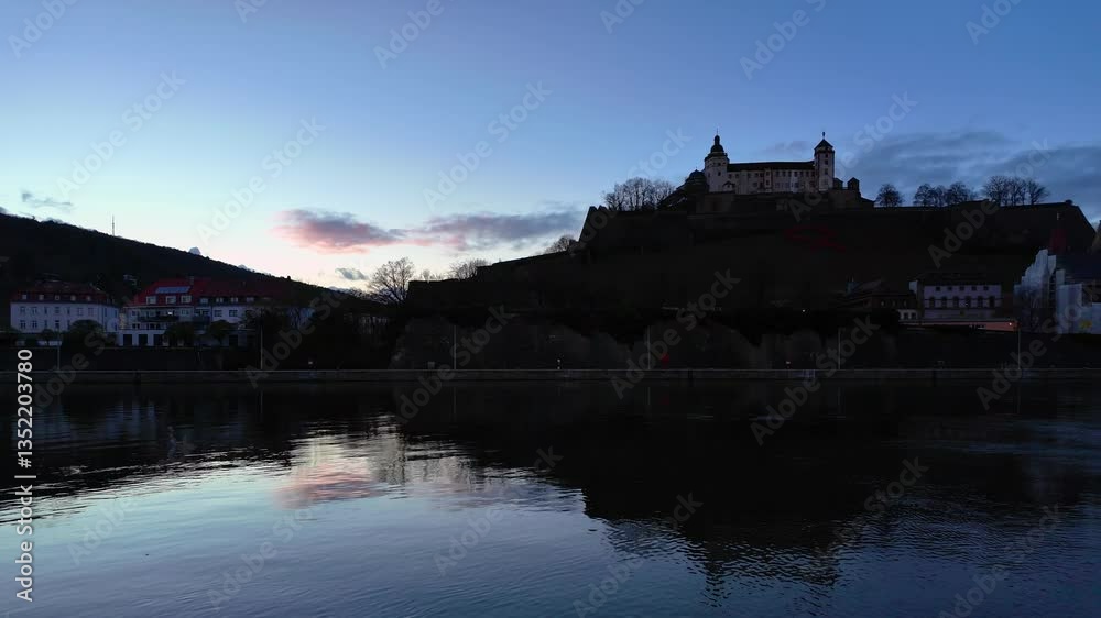 Sunset behind the famous Marienberg Fortress in Würzburg, Germany. Beautiful slow motion video in blue hour. Sunset behind the famous Marienberg Fortress in Würzburg, Germany. Beautiful slow motion video in blue hour.