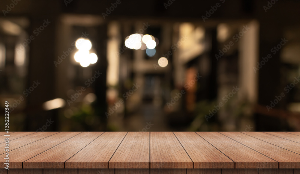 Fototapeta premium Empty wooden table top with lights bokeh on blur restaurant background.