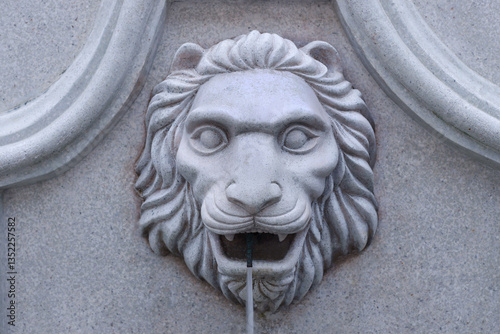 Close up marble of lion head sculpture and fountain with decorative art roman style,ancient with lion head isolated on background