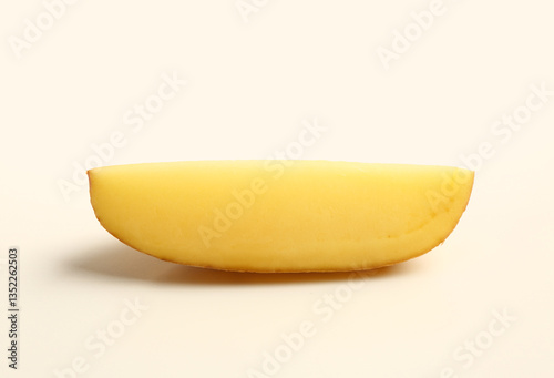 Freshly cut potato wedge is...