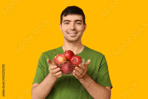 Young man with apples rich ...