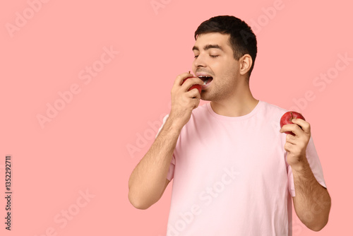 Young man with apples rich ...