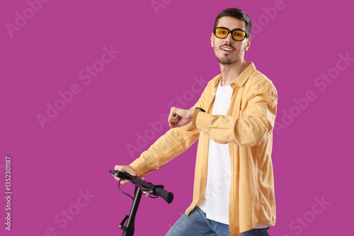 Young man with electric sco...