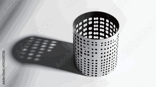 High-angle, close-up view of a cylindrical object made of perforated metal. The cylinder is positioned on a bright white surface, casting a distinct shadow.  The perforations create a repeating