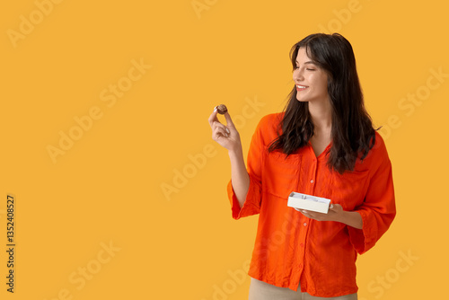 Young woman with box of tas...
