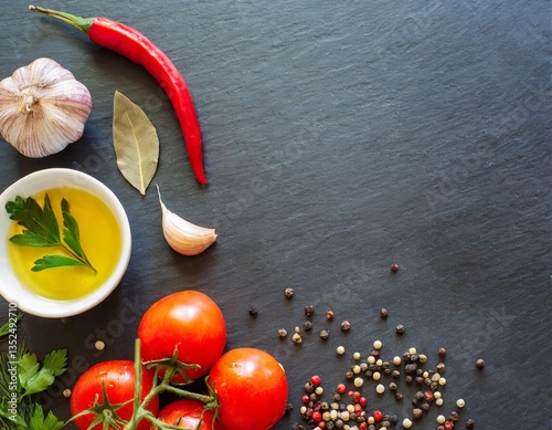 Food background, spices, tomatoes and oil on a black background, web banner with free space for text. High quality photo
