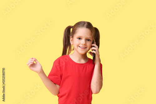 Happy little girl talking b...