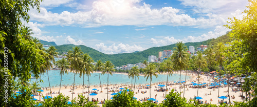 tropical beach with crowd a...
