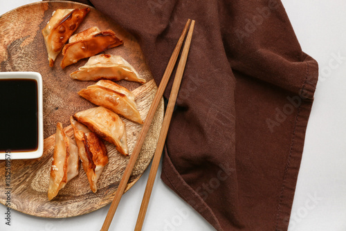 Wooden plate with fried Jap...