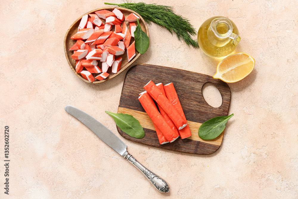 Fototapeta premium Wooden board nd plate with tasty crab sticks on beige background