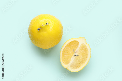 Lemons with piercing on blu...
