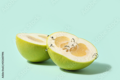 Halves of citrus fruit with...