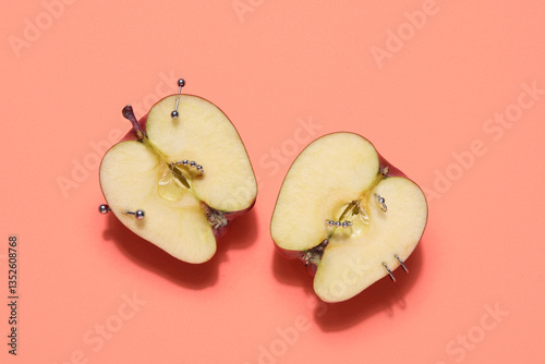 Halves of apple with pierci...