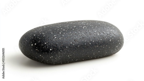 Wet smooth black pebble or river rock with water droplets on its shiny minimalist surface against a clean serene background