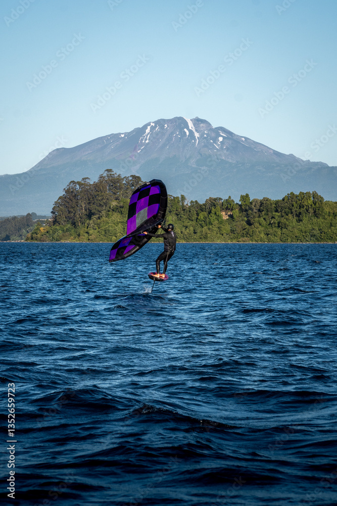 man practicing wing foil in the lake