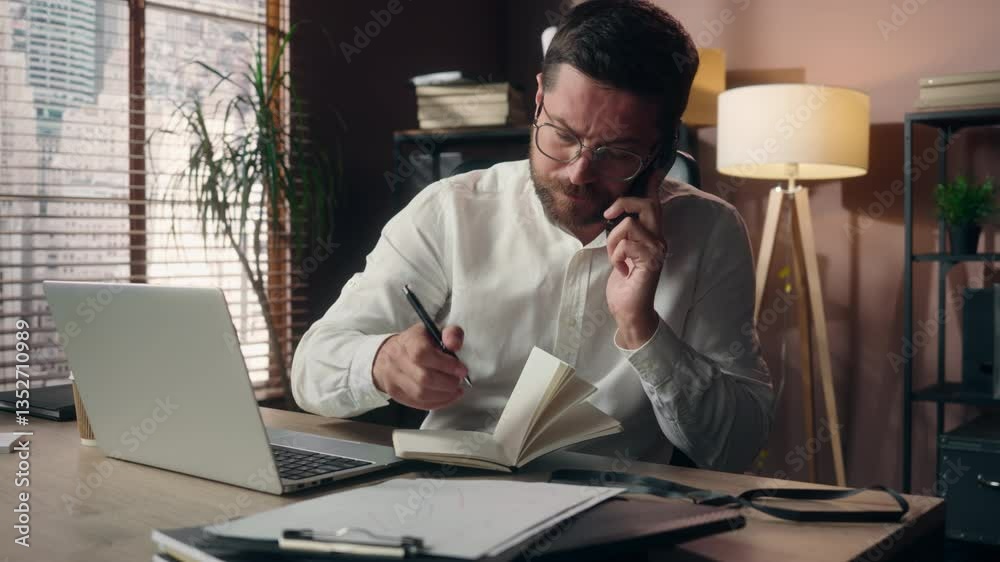 Busy Caucasian worker ceo corporate employee executive lawyer guy talk mobile phone man male multitasking manager use laptop business entrepreneur research in office businessman writing data deadline