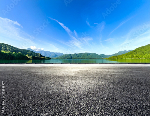 Asphalt road square and clear lake with green mountain nature landscape under blue sky. Car background.