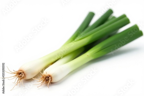 Fresh green onion stems with bulbs isolated on white background, garden details , plant, green