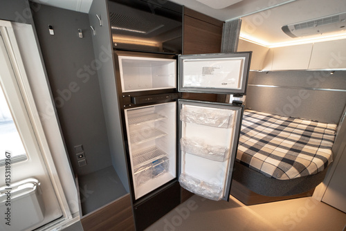 ANKARA,TR-AUGUST 20,2024:Interior with,tables,refrigerator,kitchen corners,ceiling ligthning,couches,living space in modern Adria Alpina 583 LP.