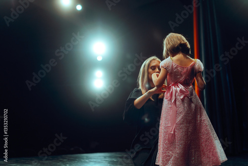 фотографія Mom Prepares Her Little Girl to Go on Stage