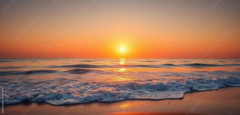 Obraz premium Golden sunset over tranquil beach, waves lapping shore, relaxation, vacation