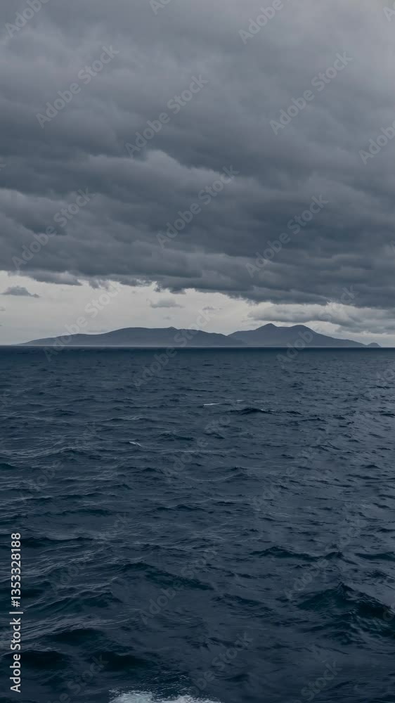 Dramatic seascape video with a wide-angle view, capturing turbulent waves under a moody, overcast sky, evoking a sense of vastness and solitude. Dramatic seascape video with a wide-angle view, capturing turbulent waves under a moody, overcast sky, evoking a sense of vastness and solitude.