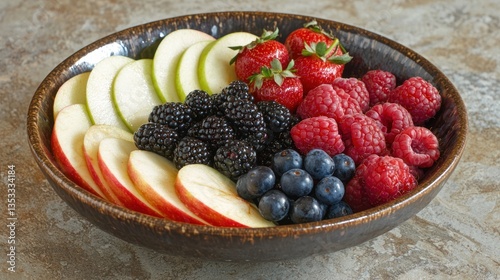 Obraz na płótnie A bowl of fresh fruit with a variety of berries and sliced apples as a healthy snack w salonie